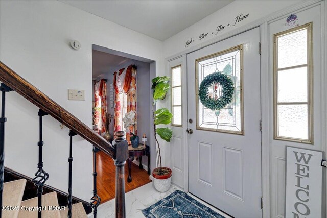 foyer featuring a wealth of natural light