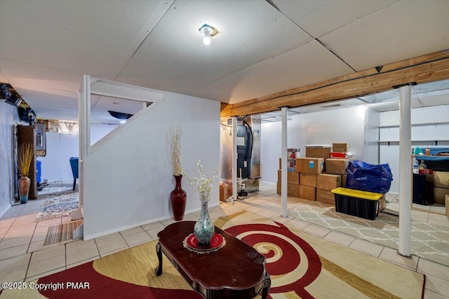 finished basement with tile patterned flooring and electric panel