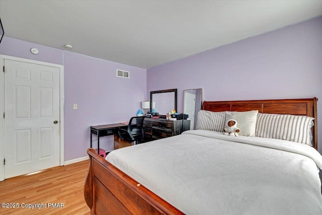 bedroom with light wood-type flooring