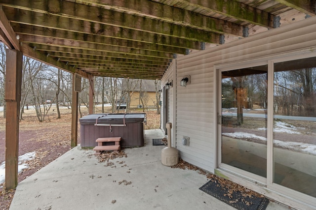 view of patio with a hot tub