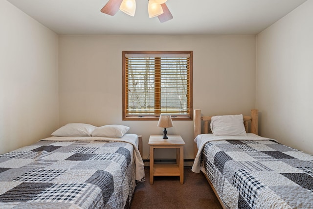 bedroom featuring a ceiling fan, carpet, and baseboard heating