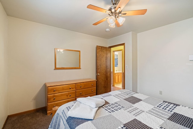 carpeted bedroom featuring baseboards and a ceiling fan