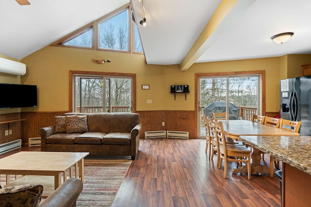 living area featuring a baseboard heating unit, wainscoting, a wall unit AC, and vaulted ceiling with beams