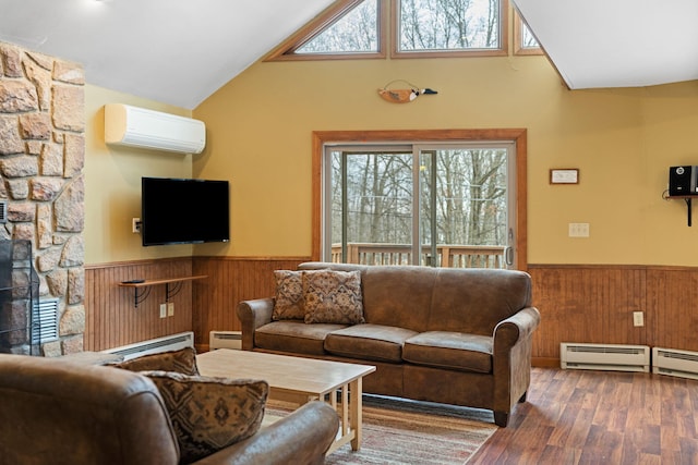 living room featuring wainscoting, a wall mounted air conditioner, and a baseboard radiator