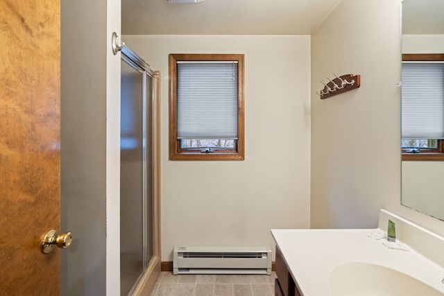 bathroom with baseboard heating, vanity, and a stall shower