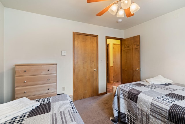 carpeted bedroom with a ceiling fan