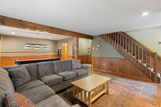 living area with wainscoting, stairway, wood finished floors, pool table, and beamed ceiling