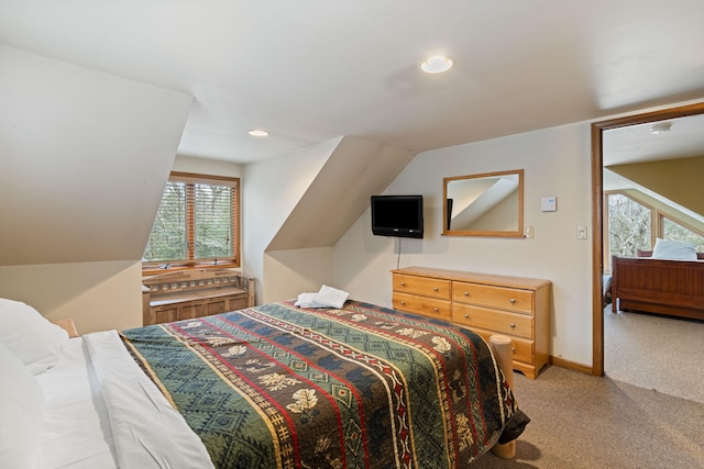 carpeted bedroom with recessed lighting, vaulted ceiling, and baseboards