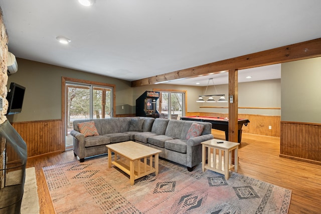 living area featuring a wainscoted wall, pool table, a wall mounted AC, wood walls, and wood finished floors