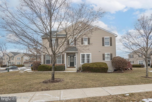 view of front of home featuring a front yard