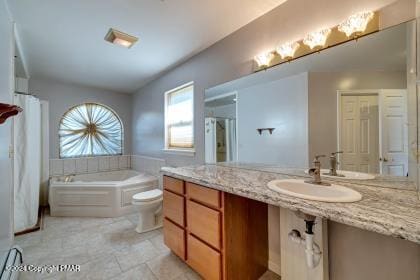 bathroom with toilet, a garden tub, and a sink