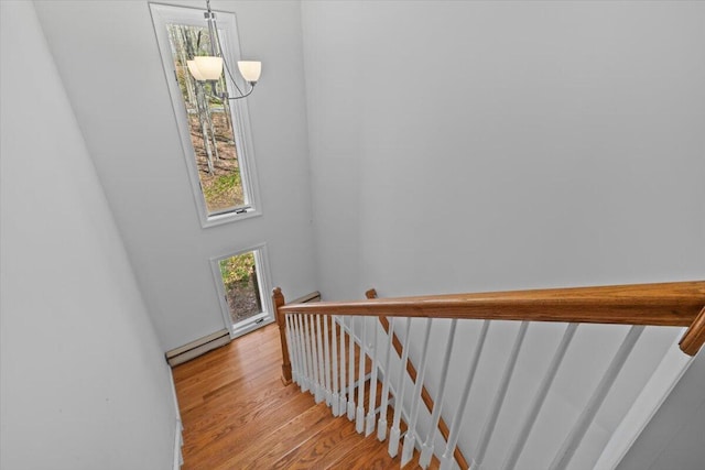 1232 Redwood Ter, Pocono Pines, PA 18350 - stairs with an inviting chandelier and wood finished floors