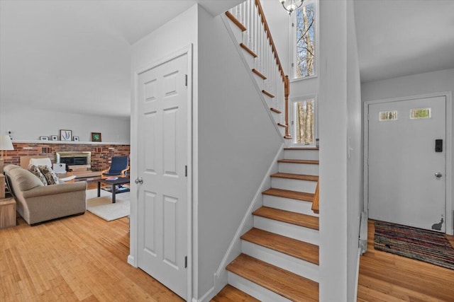 1232 Redwood Ter, Pocono Pines, PA 18350 - stairs featuring wood finished floors and a fireplace