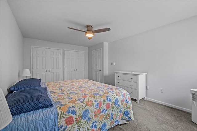 1232 Redwood Ter, Pocono Pines, PA 18350 - carpeted bedroom with baseboards, ceiling fan, and two closets
