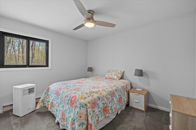 1232 Redwood Ter, Pocono Pines, PA 18350 - bedroom with baseboards, carpet flooring, ceiling fan, and a baseboard heating unit
