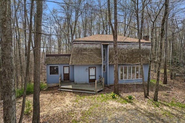 1232 Redwood Ter, Pocono Pines, PA 18350 - view of front of home with a chimney and roof with shingles