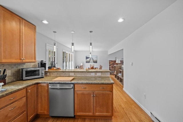 1232 Redwood Ter, Pocono Pines, PA 18350 - kitchen featuring brown cabinets, dishwasher, a peninsula, light wood-type flooring, and a toaster