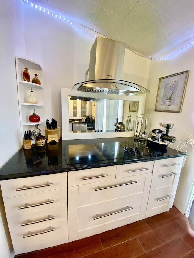 bar featuring dark wood finished floors, black electric cooktop, and island exhaust hood