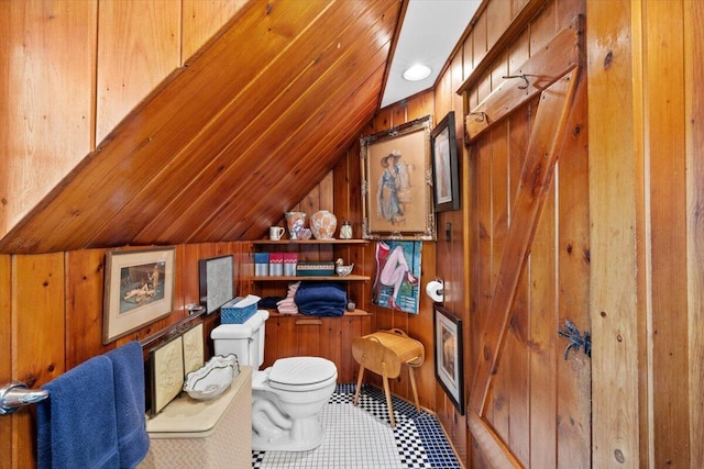 office area with lofted ceiling and wood walls