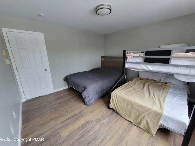 bedroom with hardwood / wood-style flooring