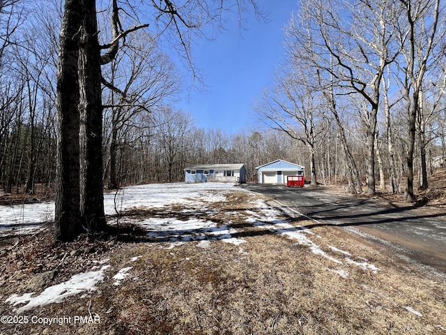 view of front of home with an outbuilding and a garage