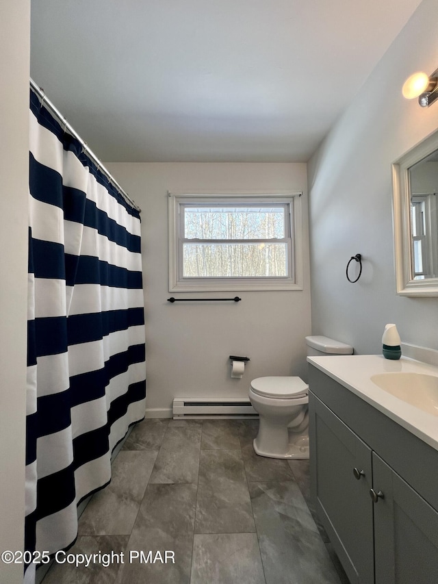 bathroom featuring a baseboard radiator, vanity, and toilet