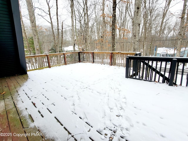 view of snow covered deck