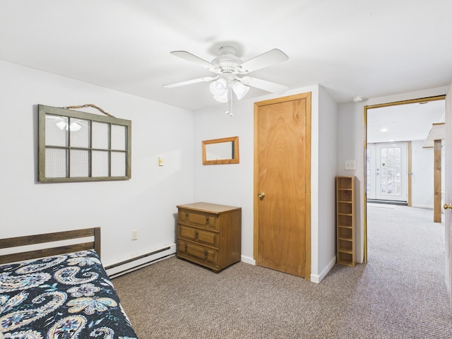 carpeted bedroom featuring a baseboard radiator, ceiling fan, and baseboards