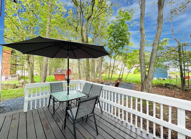 8540 Hillcrest Dr, Tobyhanna, PA 18466 - deck featuring a storage unit and outdoor dining space