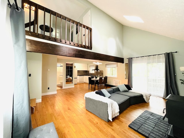 8540 Hillcrest Dr, Tobyhanna, PA 18466 - living room featuring high vaulted ceiling and light wood-style floors