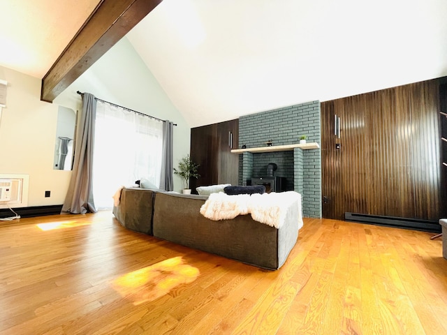 8540 Hillcrest Dr, Tobyhanna, PA 18466 - living area with a baseboard heating unit, wood finished floors, beam ceiling, a brick fireplace, and high vaulted ceiling