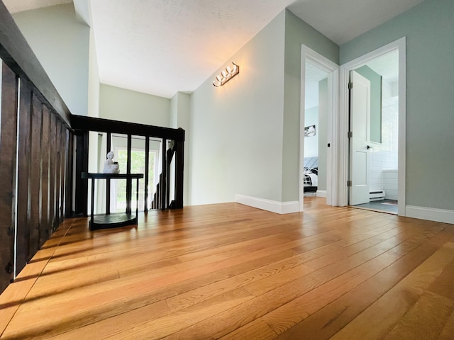 8540 Hillcrest Dr, Tobyhanna, PA 18466 - foyer entrance featuring hardwood / wood-style flooring and a baseboard heating unit