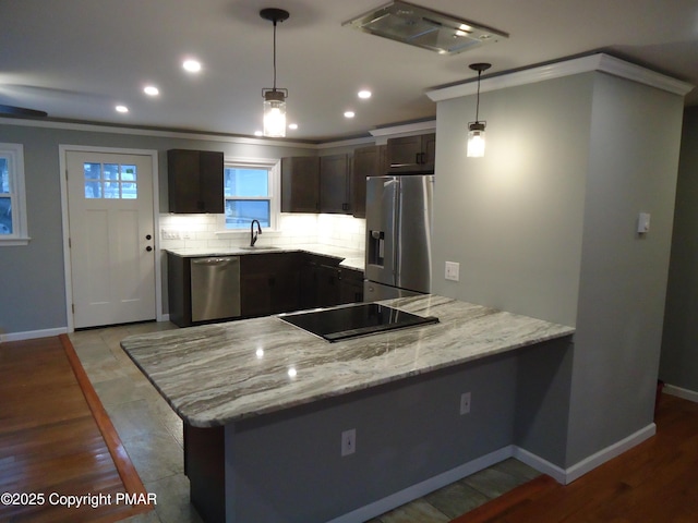 kitchen featuring dark brown cabinetry, light stone countertops, pendant lighting, and stainless steel appliances