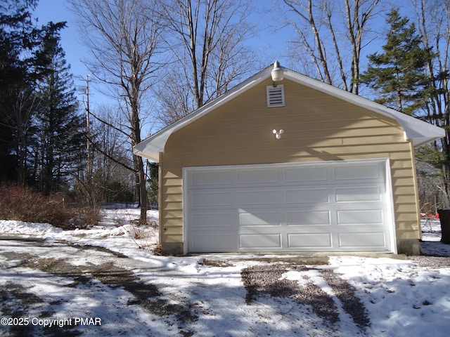 view of snow covered garage