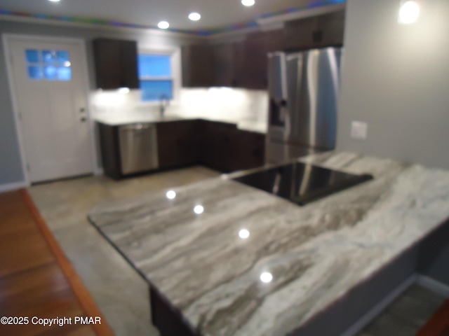 kitchen featuring dark brown cabinetry, stainless steel fridge with ice dispenser, and kitchen peninsula