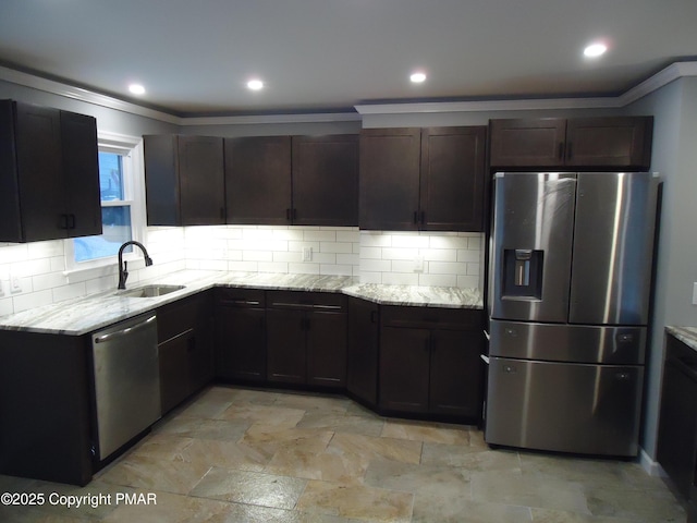 kitchen with sink, appliances with stainless steel finishes, dark brown cabinets, tasteful backsplash, and light stone countertops