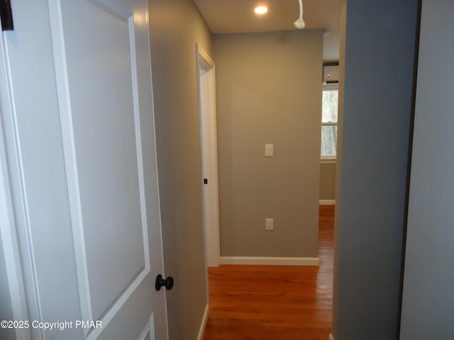 corridor featuring wood-type flooring