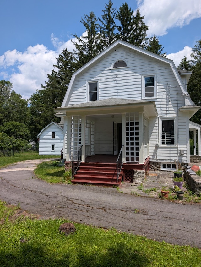 1105 Rte 390, Cresco, PA 18326 - colonial inspired home with a gambrel roof and covered porch