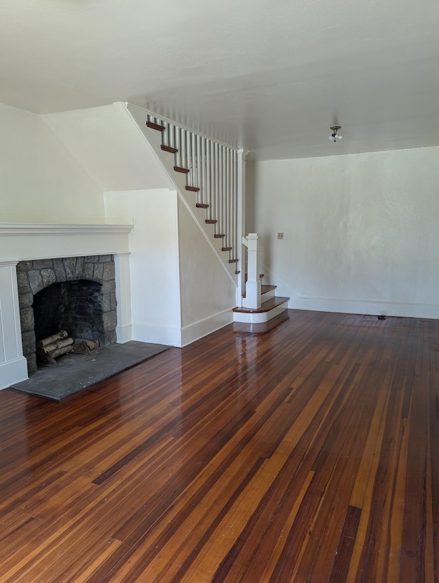 1105 Rte 390, Cresco, PA 18326 - unfurnished living room featuring hardwood / wood-style floors, stairway, and a fireplace