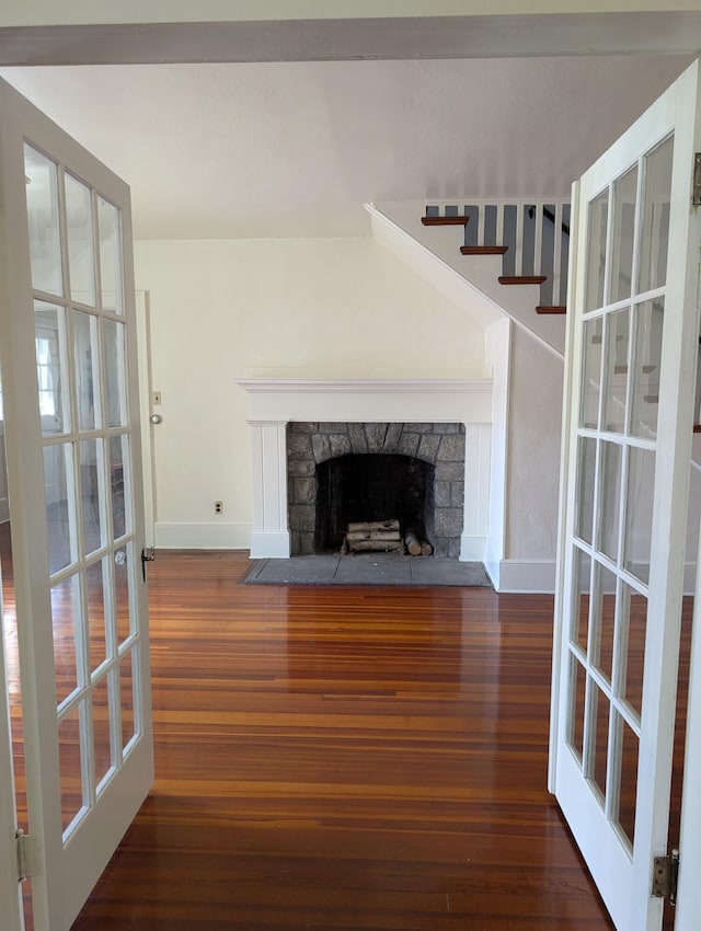 1105 Rte 390, Cresco, PA 18326 - unfurnished living room featuring wood finished floors, a fireplace, and stairway