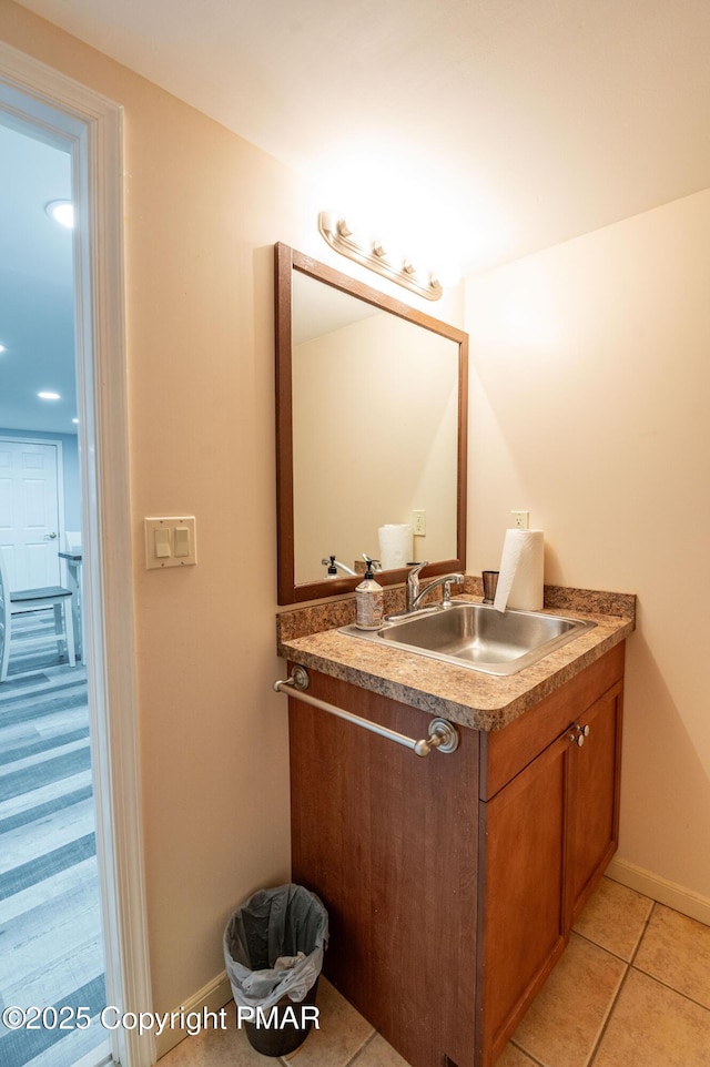 bathroom with tile patterned flooring and vanity