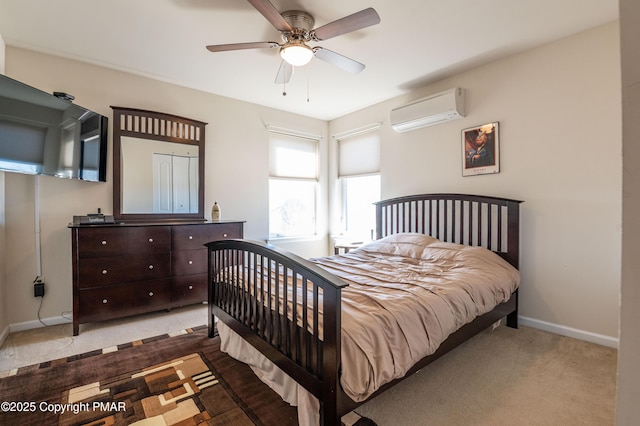 bedroom with a wall mounted air conditioner, light carpet, and ceiling fan