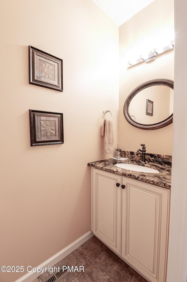 bathroom featuring vanity and tile patterned flooring