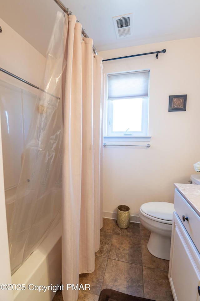 full bathroom with vanity, shower / tub combo with curtain, and toilet