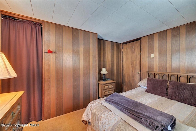 bedroom with wooden walls