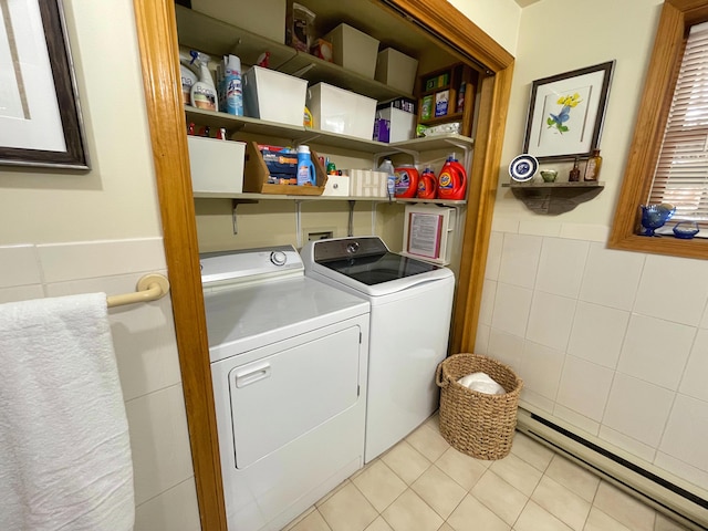 25 Cobblewood Dr, Mount Pocono, PA 18344 - laundry room with a baseboard heating unit, washing machine and dryer, tile walls, a wainscoted wall, and light tile patterned flooring
