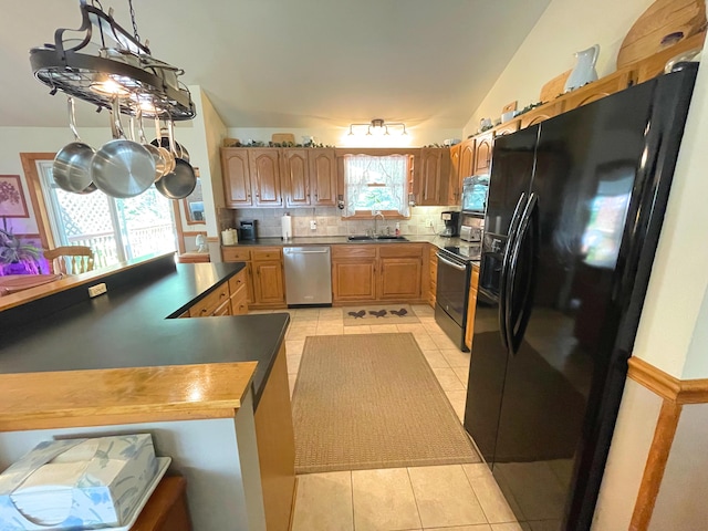 25 Cobblewood Dr, Mount Pocono, PA 18344 - kitchen with black refrigerator with ice dispenser, dishwasher, range with electric cooktop, light tile patterned flooring, and backsplash