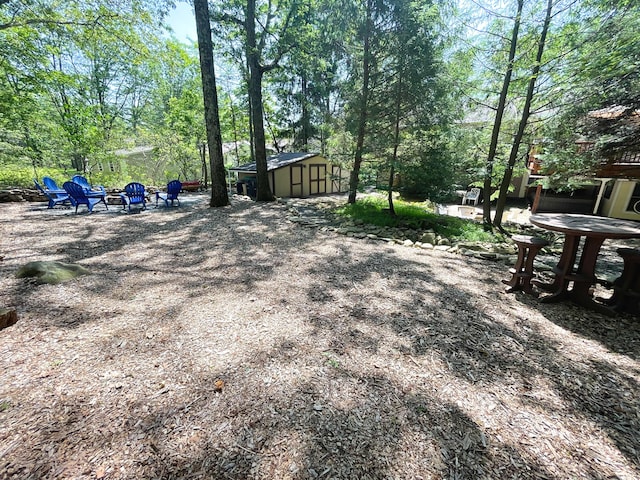 25 Cobblewood Dr, Mount Pocono, PA 18344 - view of home's community with a shed and view of scattered trees
