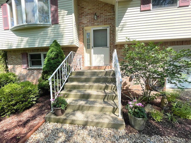 25 Cobblewood Dr, Mount Pocono, PA 18344 - view of exterior entry featuring brick siding