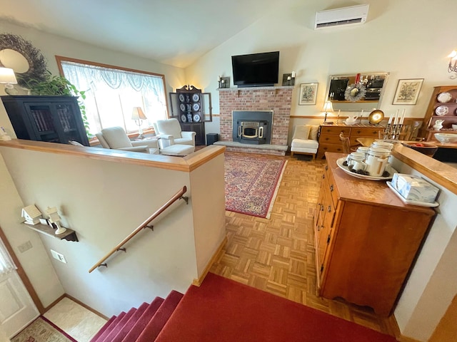 25 Cobblewood Dr, Mount Pocono, PA 18344 - living area featuring a wall mounted air conditioner, lofted ceiling, and a fireplace